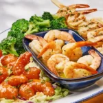 Crispy dragon shrimp served with spicy dragon shrimp sauce and crunchy golden shrimp in restaurant-style seafood presentation
