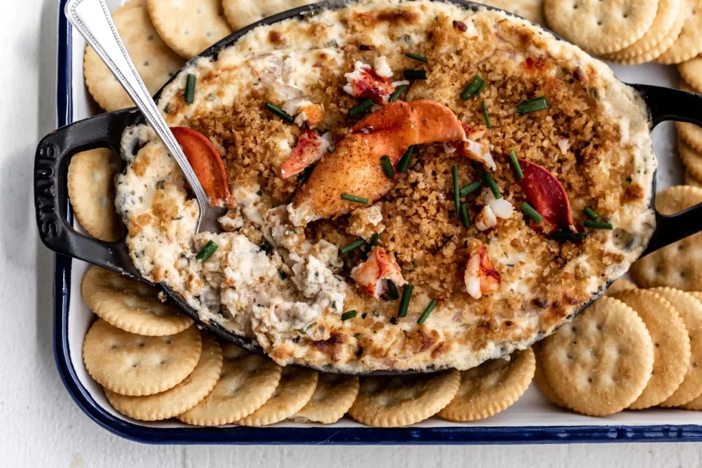creamy lobster dip served with garlic bread seafood crackers and side dishes