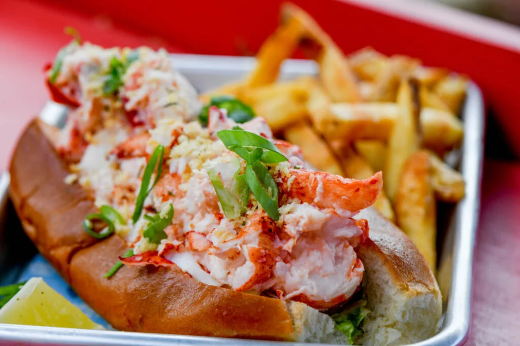 What is included in Maine lobster bake with fresh Maine lobster, clams, mussels, corn, and potatoes served together