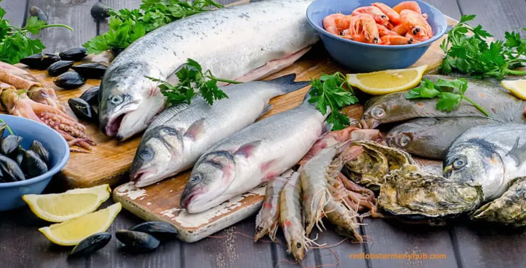 Different types of seafood to eat, including salmon, shrimp, lobster, crab, oysters, mussels, tuna, and scallops, are displayed on a seafood platter