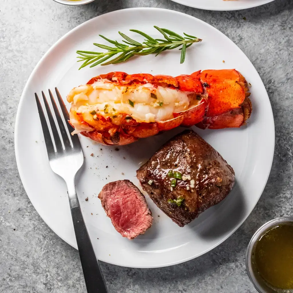 Ingredients used in Red Lobster Surf & Turf Maine Lobster Tail & 7 oz. Sirloin, including wild-caught Maine lobster tail, sirloin steak, butter, garlic, lemon, herbs, and seasonings.