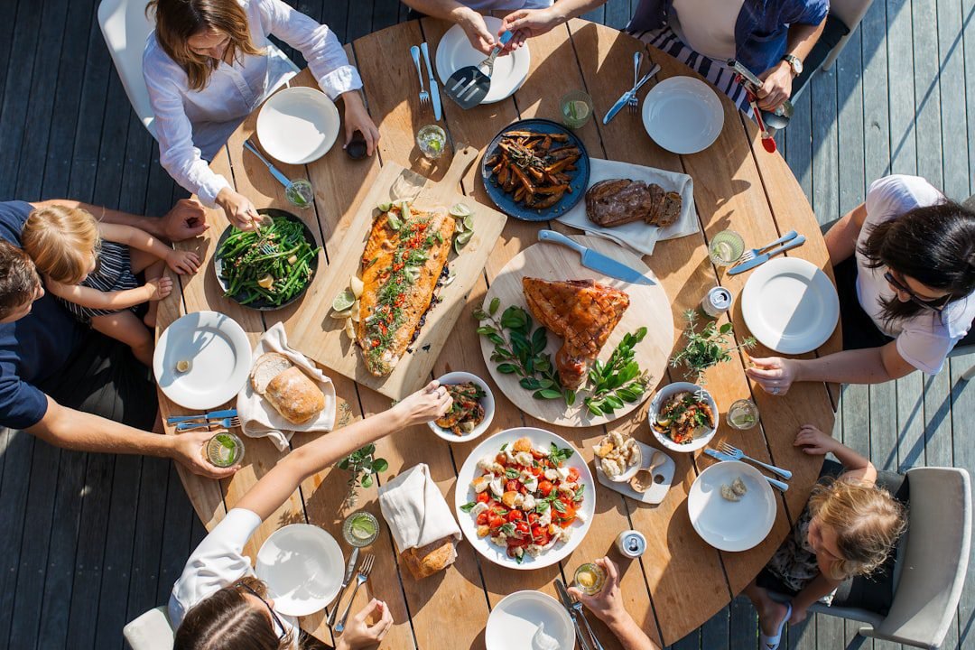 Family sharing a seafood meal together at a restaurant table