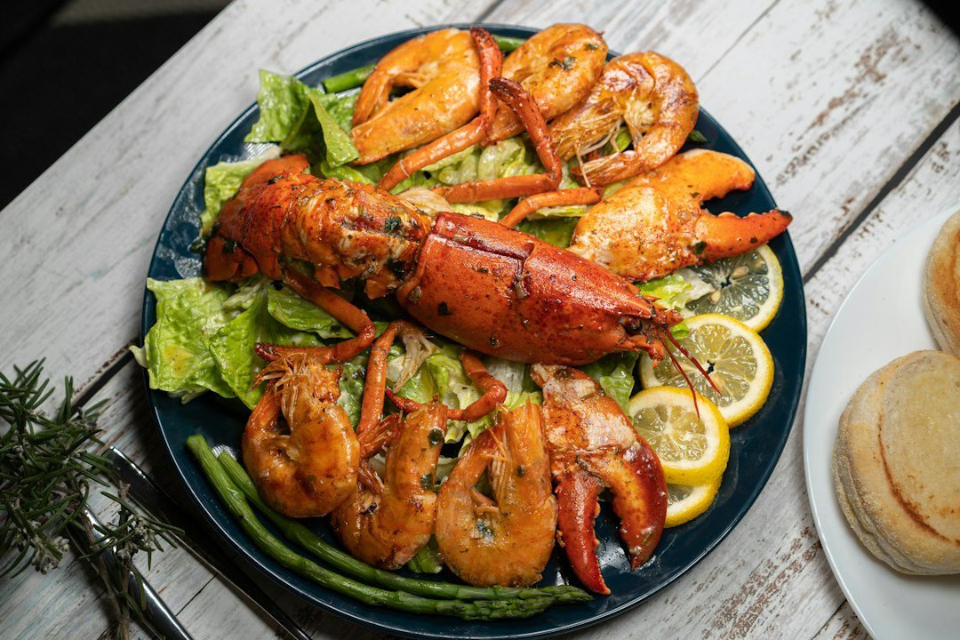 Grilled Maine lobster tail and shrimp served with sides at Red Lobster